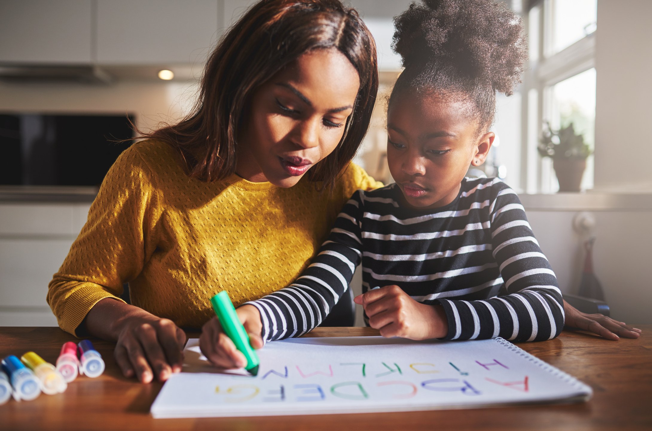 Black Mother and Child Doing Homework