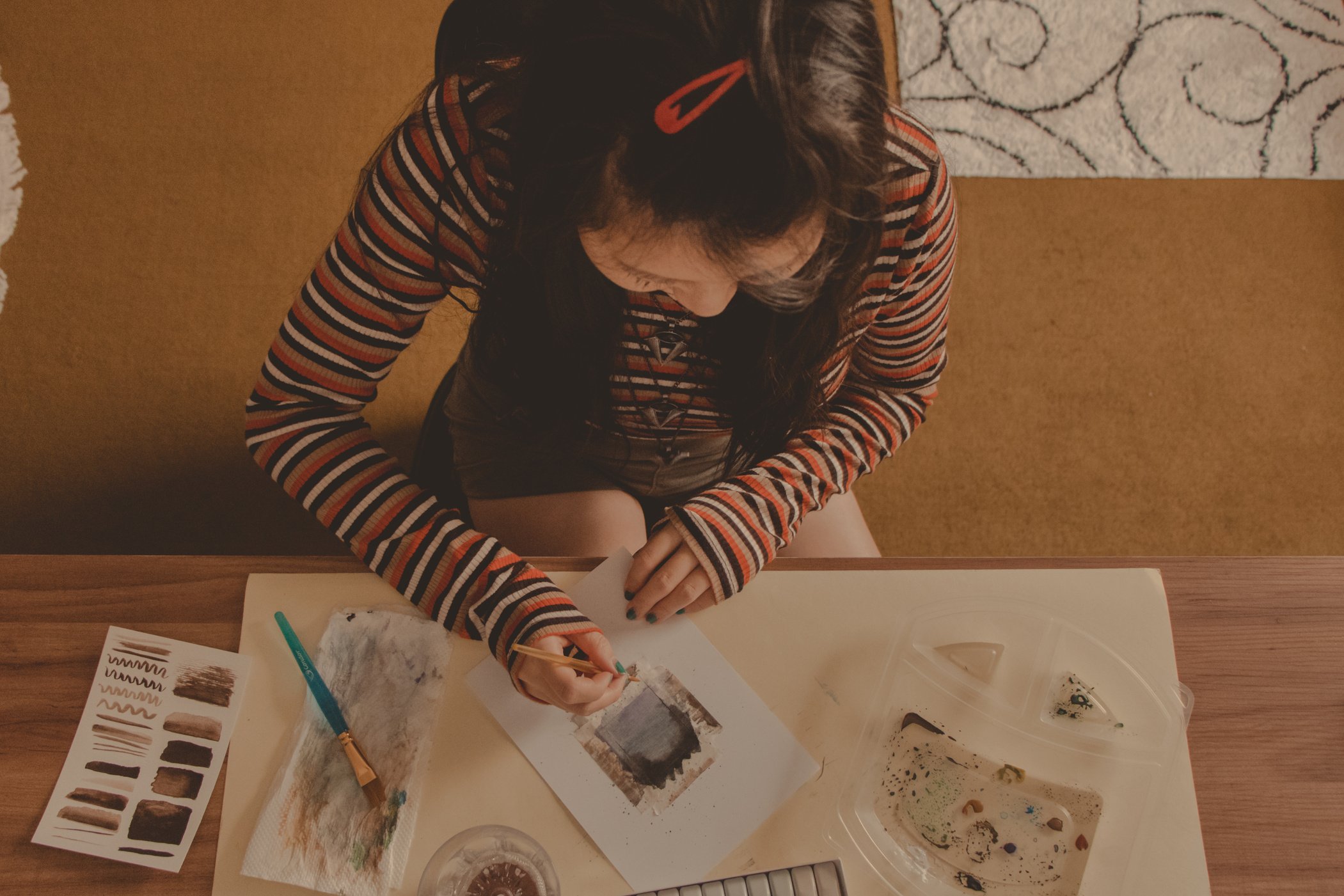 girl painting in an artsy studio